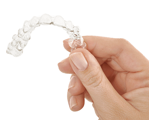 Hand Showing Invisalign Clear Aligner