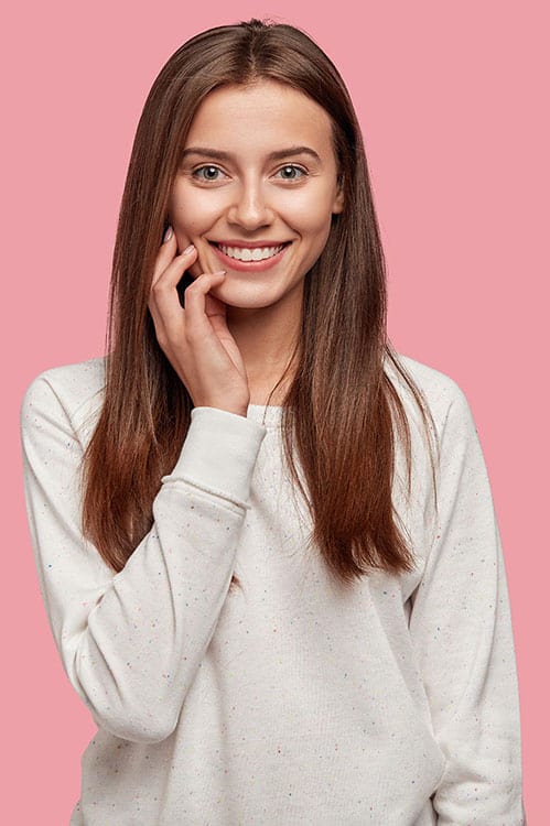 Beautiful young woman with pleasant appearance tender smile